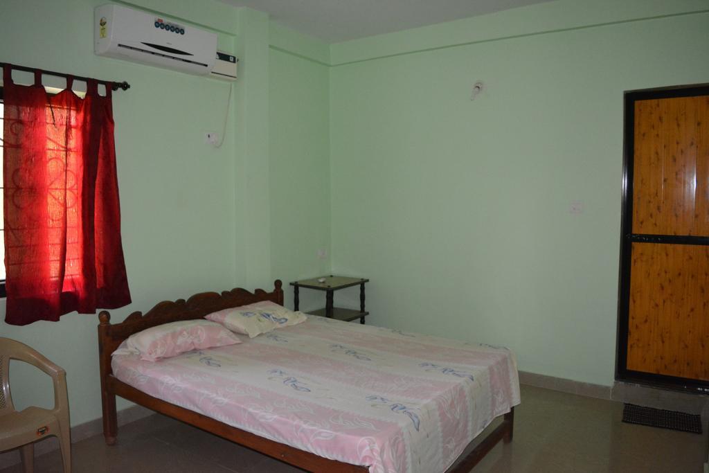 Vailankanni Guesthouse Morjim Szoba fotó